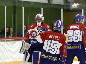 Rayside-Balfour Canadians goalie Brayden Lachance bumps fists with Canadians forward Matt Neault after James White's first-period goal against the Cochrane Crunch during NOJHL action at Chelmsford Arena on Friday, April 13, 2018. Ben Leeson/The Sudbury Star/Postmedia Network