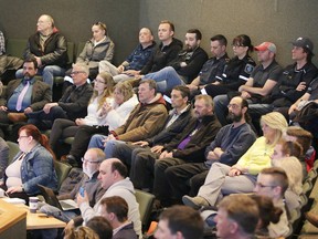 A packed gallery including members of Greater Sudbury EMS and fire services watch as city councillors meet to vote on the proposed firemedic plan in Sudbury on Tuesday. Council rejected the plan. Gino Donato/Sudbury Star/Postmedia Network