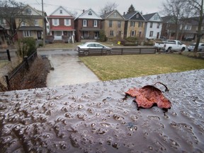 ce from freezing rain starts to form on a railing in Toronto on Saturday April 14, 2018. Environment Canada has issued a weather warning that up to 20mm or ice build up is possible. THE CANADIAN PRESS/Frank Gunn