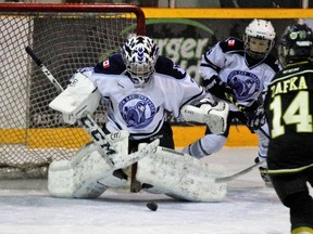 Owen Heroux, North Bay Major Atom AA Trappers goalie, covers up a rebound after making a save against the London Jr. Knights in OHF championship tournament action at the Sam Jacks Recreation Complex, Saturday. Dave Dale / The Nugget