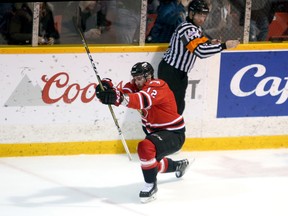 Brett McKenzie celebrates his goal, the Attack's fifth, in the second period of Game 6 between the Owen Sound Attack and Sault Ste. Marie Greyhounds at the Harry Lumley Bayshore Community Centre on Sunday. Greg Cowan/The Sun Times