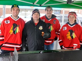 Nick Jung (left), Mark Crawford (team president), Mackinnon Hawkins and Reid Ramseyer of the Mitchell Jr. C Hawks held a fundraiser at Walkom’s valu-mart last Saturday, April 14 for those affected by the tragic Humboldt Broncos bus crash April 6. ANDY BADER/MITCHELL ADVOCATE