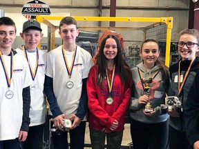 Mitchell finished as the top two teams at the D & D Automation’s Battle of the Bots in Stratford April 11. Danielle West (teacher), Jayden Yanke, Austin Weir and Connor MacLean finished second, while the top team featured Emily Dearing, Sydney Ryan and Julia Dowson. Also lending a hand to the cause was Eric Dearing (right). SUBMITTED