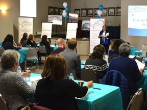 Becky Wells, the executive director of Wellspring, presenting the proposed housing project to local businesses. (Taryn Brandell | Whitecourt Star)