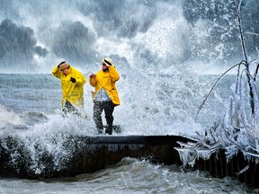 Valerie Hickey and Stacy Botting-Campbell of Port Ryerse check out the Lake Erie shoreline during this weekend's wild weather in this photo by Daryl Granger of RoseLe Studio in Simcoe. Most everyone else stayed inside Saturday and Sunday thanks to a non-stop wintery mix of snow, sleet, freezing rain and cold winds out of the northeast. (RoseLe Studio photo)