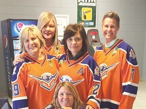 Soo Thunderbird hockey moms, clockwise, from front, are Lorie Bellini, Paula Theriault, Raea Caruso, Patti Smith and Carol Ford.