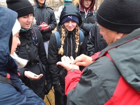 Kevin Morland, right, displays telltale signs of clean water quality to students at the 2018 Envirothon, held at the Springwater Conservation Area near Aylmer, Ontario. Despite the chilly weather and occasional snow, teams of five still came from from all over the region including St. Thomas, East Elgin, West Elgin, London, and Strathroy. (Louis Pin/Times-Journal)
