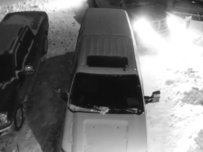 Video footage of a red Dodge believed to be involved in a hit-and-run leaving after hitting two parked trucks in a driveway on January 13 in Eagle Ridge. Supplied image/Wood Buffalo RCMP