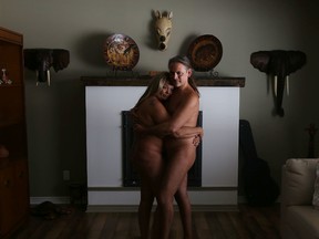 Nudists Yvonne Gibson and Hector Gravelle stand in the living room of Freedom Fields Naturist Ranch. The couple say their lifestyle and rights were infringed when Stone Mills Township denied a rezoning application that would allow them to expand their business outside Tamworth. (Elliot Ferguson/The Whig-Standard)