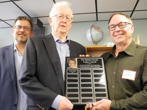 The Haldimand-Norfolk Literacy Council marked National Volunteer Week in Canada by awarding the inaugural Shirley Devlin Legacy Award to council director James Adams Jr. of Simcoe, at right. On hand for the event Monday was Doug Devlin, centre, husband of the late Shirley Devlin, and the couple's son John Devlin, left, of Boston, Mass. MONTE SONNENBERG / SIMCOE REFORMER