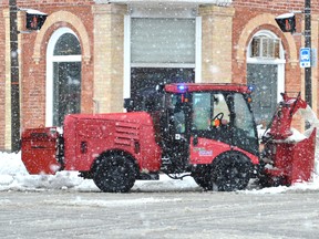 A City of Owen Sound sidewalk plow is used to cut back snowbanks on Monday. (Sun Times files)