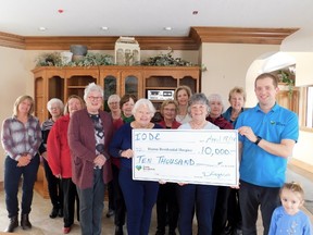 Michelle Field (far left), Jay McFarlan (far right) and the ladies of the IODE Maple Leaf Chapter with the $10,000 donation. Currently, it is undecided what the donation will fund at the hospice, but the ladies of the IODE were considering their options such as anything related to home décor or furnishing, which also included purchasing a specialized bed (cost upwards of $10,000); where the money will help is to be decided. (Kathleen Smith/Goderich Signal Star)