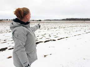 Julie Danen stands next to a snow-covered field on the dairy and cash-crop farm she owns along with husband Ed on Wednesday, April 18, 2018 in Shakespeare, Ont. (Terry Bridge/Stratford Beacon Herald)