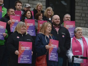 Kingston General Hospital staff gather on the hospital steps during an organized lunch-hour walkout on Wednesday April 18 2018 on behalf of healthcare workers across the province. Jonathan Ludlow/Kingston Whig-Standard/Postmedia Network