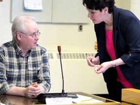 Lindsay Liske and Rose Burton Spohn speak before the start of a meeting of Huron-Superior Catholic District School Board trustees on Wednesday.