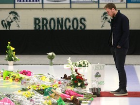 NHL player Connor McDavid visits the on ice memorial at the Elgar Peterson Arena to pay his respects to the Humboldt Broncos hockey players who lost their lives in a bus crash in Humboldt, Sask., on April 17, 2018. (Michelle Berg / Saskatoon StarPhoenix)