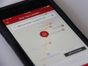 Image of the SkipTheDishes iPhone app showing a Stratford address. The app allows users to order food from local restaurants and have it delivered to their homes. (JONATHAN JUHA/THE BEACON HERALD)