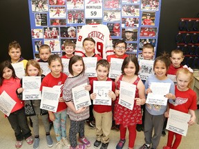 Grade 3 students at Queen Elizabeth II Public School in Sudbury, Ont. show letters they wrote to Tyler Bertuzzi congratulating him on scoring his first NHL goal with the Detroit Red Wings. Bertuzzi wrote back to all of the students thanking them and answering their questions. John Lappa/Sudbury Star/Postmedia Network