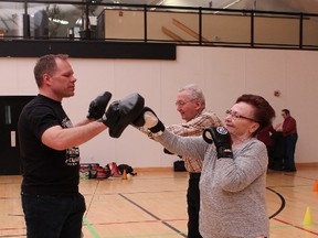 PHOTO BY DIANA RINNE
Volunteer Raphael Bergmann (left) puts Leslie Fraser (centre) and Joan Roberts (right) through their paces during a boxing session at the PWR!4Life program at the Reach Centre in Grande Prairie. The program is a community partnership between Alberta Health Services and Parkinson Association of Alberta.