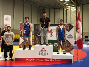 Isaiah Springer, right, won bronze at the U17/U19 Canadian Wrestling Championships in Edmonton over the weekend.