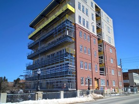 Owen Sound staff and developer/owner Ron Pirie are working to address a city stop-work order on The Sydenham riverside condominium project downtown. Concerns about documenting the fire separations to be used between floors prompted the order. Work continues on the fifth floor, with associated plumbing on the floors above and below it. (Scott Dunn/The Sun Times)