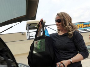 Beausejour resident Amy uses cloth bags for her grocery shopping. (Brook Jones/Selkirk Journal/Postmedia Network)