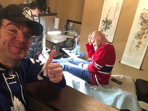 The Drive morning co-host and Whig columnist Ben McLean revels in his hockey bet that saw his co-host, Reid, get a Toronto Maple Leafs logo tattooed on the bottom of his foot. (Ben McLean/Supplied photo)