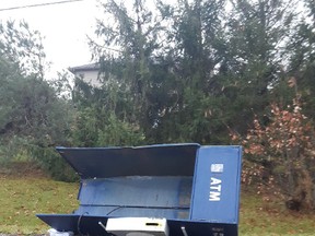 Part of an ATM sits on the side of Oakland Road, between Scotland and Oakland, last December. (Submitted Photo)