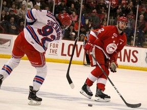 Kitchener Rangers Kole Sherwood breaks his stick taking a shot with Soo Greyhounds Noah Carroll defending during the first period of Western Conference championship series at Essar Centre on Friday.