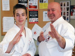 Nicholas Marceau, left, and his father, Chris, of Marceau's Martial Arts and Fighting Systems, are heading to Athens, Greece to compete at the World Kobudo Federation’s 18th World Martial Arts Convention May 4-6. They've raised $6,000 so far by picking up donated empty returnable bottles, tin cans and scrap metal over the past year.
Dave Dale / The Nugget