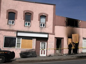 Workers board up the room where an apartment fire on Matheson St. left 18 people without a home, during the early morning hours April 20 as damage from fire, smoke and water was extensive and spread throughout the complex. SHERI LAMB/Daily Miner and News/Postmedia Network