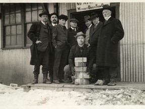 J.P. Bickell, centre, holding onto McIntyre gold bars, while other McIntyre board directors look on in this photo from 1913. There is a bid before city council to have the McIntyre Auditorium renamed in Bickell’s honour.

(Photo courtesy of the Timmins Museum)