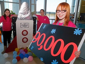 Luke Hendry/The Intelligencer
Shaelynn Boutilier, 13, displays this year's Quinte West YMCA Strong Kids campaign goal of $90,000 Sunday in Trenton. Standing with the campaign launch rocket were Deja Auger, 11, and Keisha Fudge, 12.
