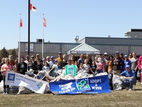 Volunteers pose in front of the garbage collected during the Friends of the Thames Thames River Clean Up in Ingersoll, Ont. on Sunday April 22, 2018. Greg Colgan/Woodstock Sentinel-Review/Postmedia Network