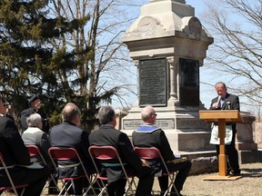 Ingersoll Museum curator Scott Gillies, right, gives a historical background in Ingersoll, Ont. on Sunday April 22, 2018 at the Ingersoll Rural Cemetery for the 100th anniversary re-dedication of Major Edward Cuthbert Norsworthy who died April 22, 1915 at the Second Battle of Ypres in the First World War. Greg Colgan/Woodstock Sentinel-Review/Postmedia Network