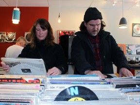 Leah Aylsworth and Martin McNenly browse albums during Record Store Day at Diamond Dogs Vinyl on Saturday, April 22, 2018 in Stratford, Ont. Terry Bridge/Stratford Beacon Herald/Postmedia Network