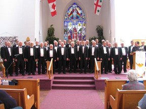 Jack Evans/For The Intelligencer
Rev. Brad Beale of St. Thomas Church, at lecturn on right, introduces the Toronto Welsh Male Voice Choir at the start of their concert in the church Sunday afternoon.