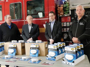 Oxford MPP Ernie Hardeman and Todd Jerry, from Insurance Bureau of Canada, presented 150 carbon monoxide alarms to three communities Friday, including Tillsonburg. From left are Tillsonburg Fire Chief Jeff Smith, Tillonsonburg Deputy Mayor Dave Beres, Hardeman, Jerry, and John Gignac,  a retired veteran of the Brantford Fire Department and Executive Director of the Hawkins-Gignac Foundation for CO Education at the Tillsonburg Fire Hall. Presentations were also made in Ingersoll and Norwich. (Chris Abbott/Tillsonburg News)