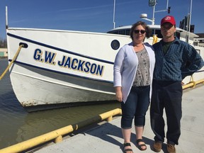 Tammy and Joe Jackson stand beside the G.W. Jackson, which was built in 1963 by Joe’s grandfather George. The vessel has been in the family since it was built, but will be sold as Jacksons Fisheries and Jacksons Fish Market has closed. (Laura Broadley/Times-Journal)