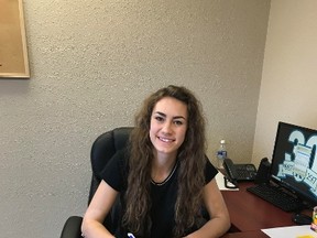 La Crete point guard Heidi Derkson (shown here) signs her letter of intent with the GPRC Wolves. Derkson and her La Crete teammates recently won the 2A provincial championship in girls basketball.