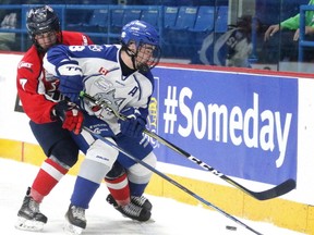 Sudbury Nickel Capital Wolves Joel Mongeon and Michael Horon of the Lethbridge Hurricanes battle for the puck during 2018 Telus Cup action in Sudbury, Ont. on Monday April 23, 2018. Gino Donato/Sudbury Star/Postmedia Network