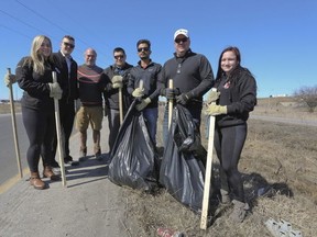 Meghan Balogh/Postmedia Network
Loyalist College Police Foundations students help collect garbage at a Highway 401 on-ramp in Napanee on Sunday. The students are participating in a special community placement designed by retired Napanee OPP detachment commander Pat Finnegan. From left are Taylor Wapshaw, Daniel Barker, Scot Powers, Cameron Young, Sunny Brar, Pat Finnegan and Micaela Cavanagh.