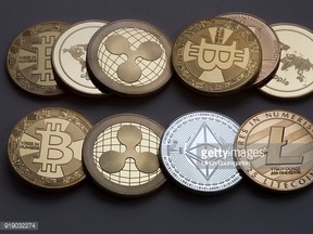 Cryptocurrencys Bitcon, Ethereum, Ripple and Litecoin (physically). Getty Images.