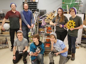 Members of the Kingston area Lake Effect Robotics — a FIRST Robotics Competition team — and coach Kevin Wood, left, are seen at Kingston Collegiate last Thursday, before packing up their robot and gear to head to Detroit for the FIRST World Championships. (Julia McKay/The Whig-Standard)