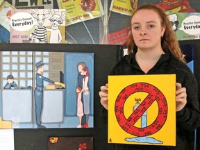 Grace Cook, a Grade 12 student at Chippewa Secondary School, shows her illustration of a boil water advisory. The numbers on the sign represent the First Nations which are currently under advisories. Cook's illustration is part of a visual arts exhibit at the school coinciding with a visit by the Tour for Humanity bus.
Jennifer Hamilton-McCharles / The Nugget