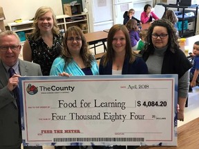 Mayor Robert Quaiff presented a cheque for $4,084.20 to the Food for Learning program earlier this week. The funds were raised during the annual Feed the Meter campaign in Picton, which was extended to March 1 this year during the transition to the Pay and Display stations in the downtown area. Pictured (from left to right) are Quaiff,  Vicky Struthers, Food for Learning Community Development Coordinator, Kellie Brace, Student Nutrition Program Coordinator, Kim Myderwyk, Principal at Queen Elizabeth School, and Terri Martin, a volunteer at Queen Elizabeth School.