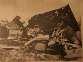 In this 1980 Today file photo, a bulldozer destroys a home belonging to a resident of Moccasin Flats near the Snye.