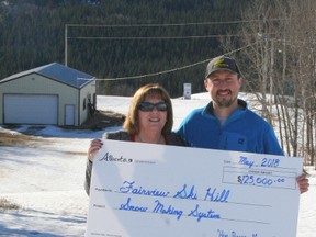 MLA Marg McCuaig-Boyd presents Fairview Ski Hill president Darian Armstrong with a cheque for $125,000 to help fund snow-making machinery for the hill. The funding is from the Community Facility Enhancement Program,