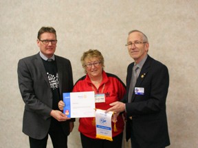 Rotary Club of Fairview members, l-r, Chris Laue, Pauline Broddle and Dennis Radbourne display a certificate of Appreciation AND banner from Rotary International for donations from the club to the Rotary Foundation that goes towards fighting polio and other Rotary initiatives. Fairview's Club was number 2 in per capita donations in Alberta to the foundation, after the Rotary Club of Whitecourt.