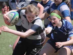 Rachel Lawson of the St. Mary's Mustangs senior girls rugby team, left, during a Doogie Cup match in 2015. James Masters/Owen Sound Sun Times